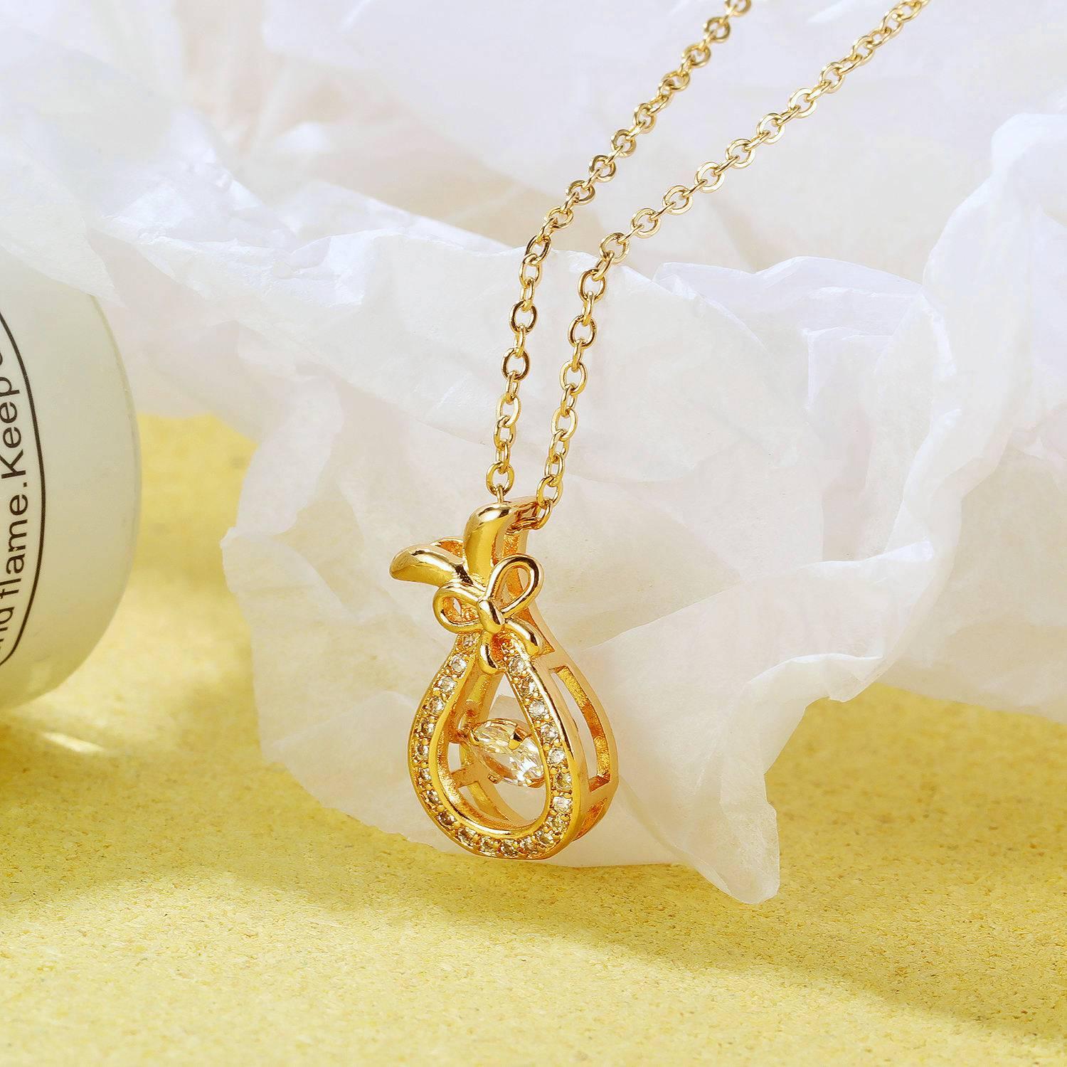 Glimmer Bow Dewdrop Necklace 1 